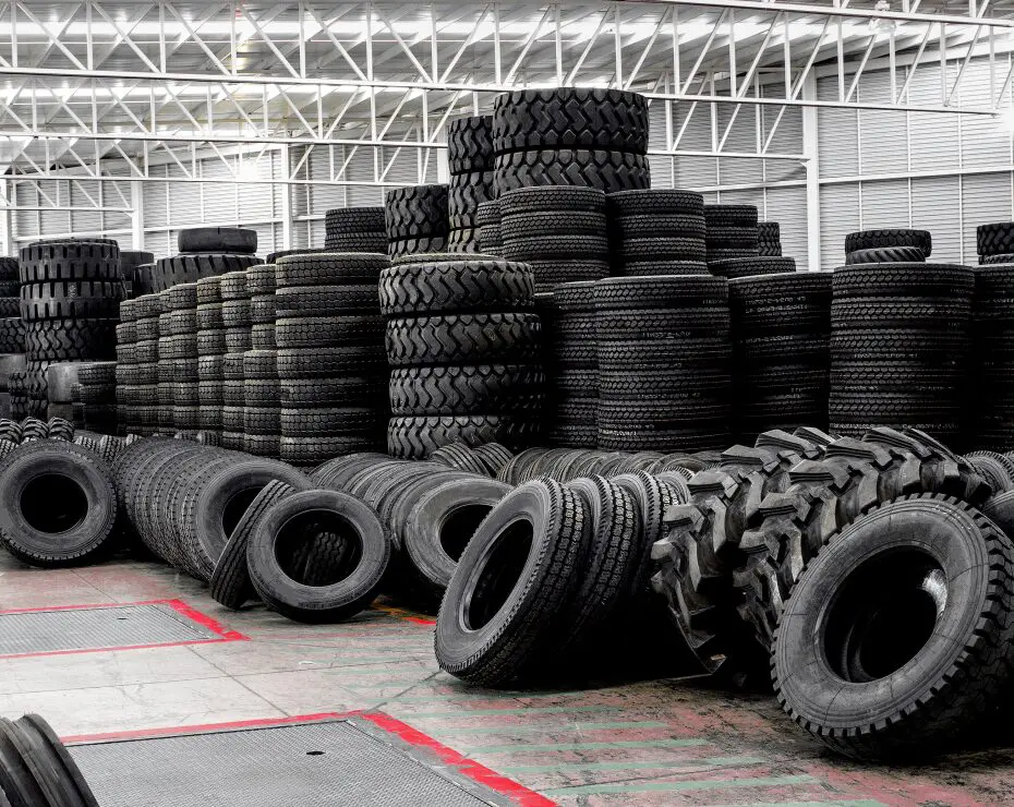 Stacks of tires in a warehouse.